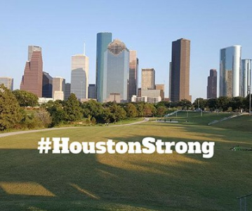 The skyline of Houston, Texas with #HoustonStrong on the front in text